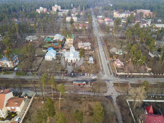 Aerial drone view. City among the forest