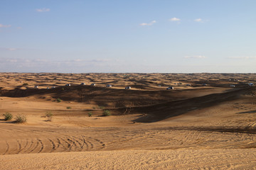 Desert Safari SUVs bashing through the arabian sand dunes