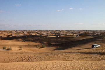 Comboy of 4x4 vehicles during a desert safari in Dubai