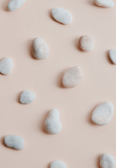 flat lay of nude tone of stones and paper as a skin tone for cosmetic with  space for text