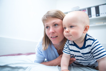 Happy mother with baby at home