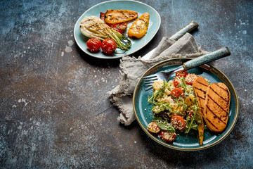 Two plates of tasty grilled fresh vegetables