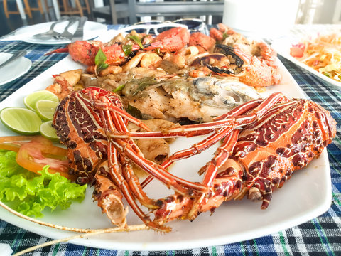 Closeup image of fresh tasty cooked seafood served on dish at the restaurant