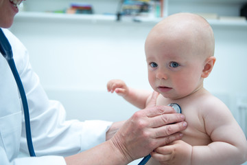 Cute baby in doctor's office