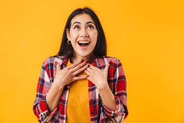 Photo of amazed brunette woman smiling while looking upward