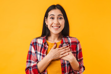 Photo of amazed brunette woman smiling while looking at camera