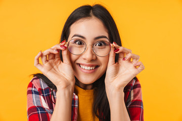 Photo of cheerful woman holding eyeglasses and looking at camera