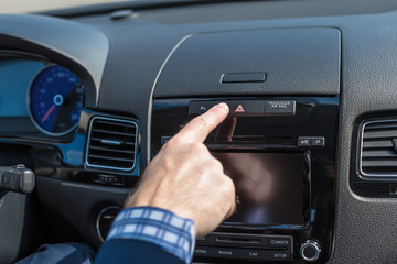 Businessman turn on car emergency stop button driving on the highway.