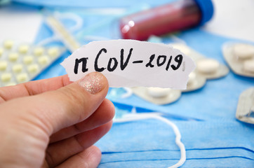 Coronavirus 2019 nCoV, text CORONAVIRUS in the hand, new coronavirus, respiratory syndrome in the...