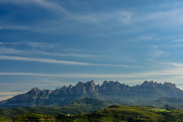 Fototapeta na wymiar Blue sky over the Mountain of Montserrat (Catalonia, Spain)