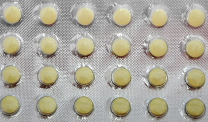 Pills in blister. Medical and pharmaceutical background. Close up.