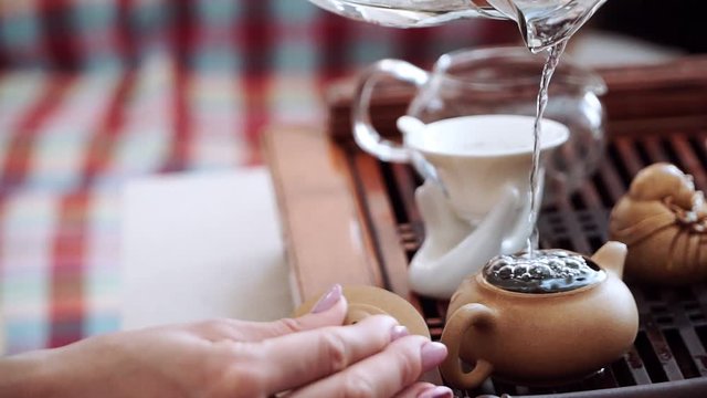 In the teapot with tea leaves pour boiling water to brew fragrant, delicious tea