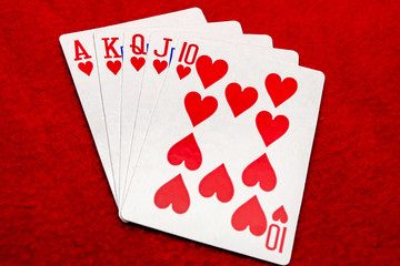 Playing cards on red background