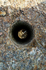 Through hole in granite stone
