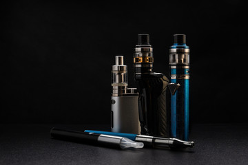 electronic cigarettes or vaping devices on black background