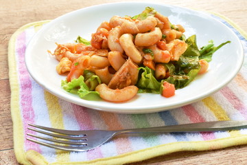 stir fried macaroni with chicken and egg dressing ketchup on plate