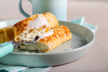 Crepe roll with soft cheese filling