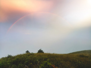 Naklejka premium The beautiful hill on the top of the hill and the bright light in the sky