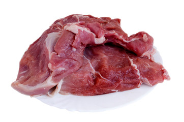Raw meat on bones in a plate