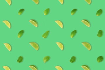 LIMES AND MINTS LEAVES PATTERN ON PASTAL BACKGROUND.
