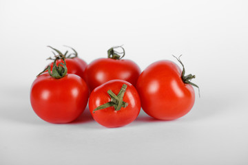 A red tomato bunch on white background