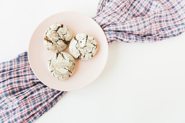 chocolate cookies on the pink plate.white minimalistic background.top view