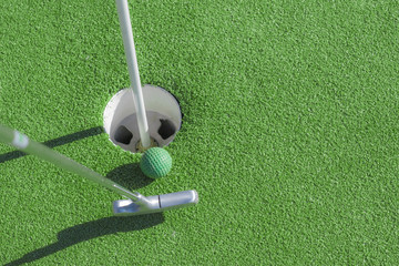 Mini golf club, ball and hole