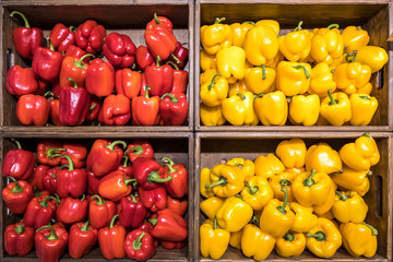 baskets with sweet red and yellow peppers in the mall