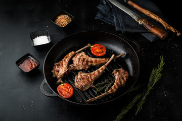 Grilled lamb ribs with spices in a frying pan