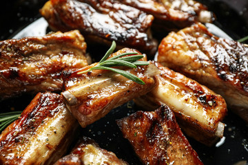 Delicious grilled ribs with rosemary, closeup view