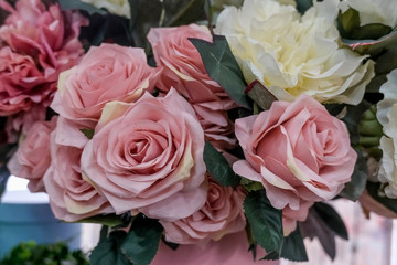 Artificial bouquet of flowers. Bouquet of mixed flowers. Floral shop, flower market. Concept of greeting, presents..