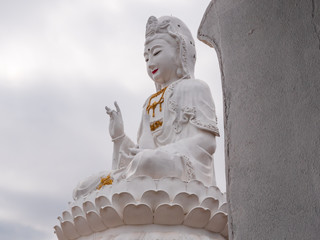 Statue of white Guanyin or Guan Yin, goddess of mercy in Huay pla kang temple in Chiang rai, Thailand. Popular tourist attractions.