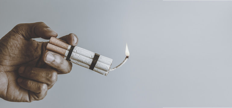 Man smoker.Cigarette like time bomb.Cigarettes is addictive to be cancer.smoking reduction campaign in World No Tobacco Day.