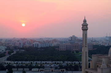 Fototapeta na wymiar Minaret of the Mosque Against Marvelous Pink Sunset Sky