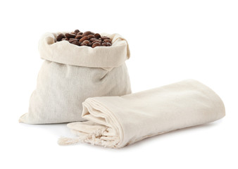 Fototapeta na wymiar Cotton eco bag with coffee beans and empty one on white background