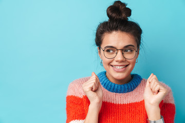 Image of happy beautiful woman smiling and looking aside