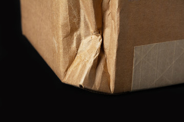 Crumpled damaged cardboard box