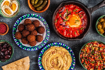 Falafel, hummus, shakshuka, Israeli salad - traditional dishes of Israeli cuisine.