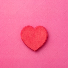 couple of wooden heart on red background. Hearts concept. Copy space.