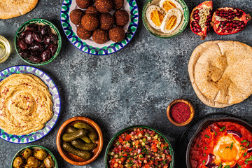 Falafel, hummus, shakshuka, Israeli salad - traditional dishes of Israeli cuisine.