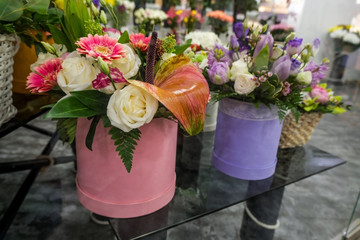 Artificial flower composition in floral shop. Floral theme, making bouquets.
