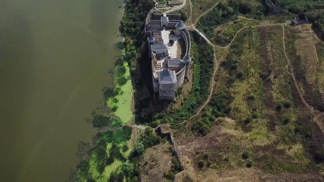 Aerial view of medieval castle near the river. Hotyn Castle in Ukraine