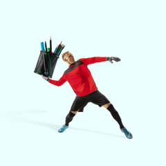 Goalkeeper giving bunch of pen like a ball on blue background. Copyspace for your proposal. Modern design. Contemporary artwork, collage. Concept of sport, office, work, dreams, business, action.