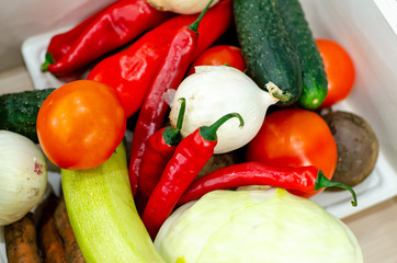 A variety of vegetables on the counter.