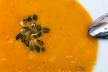 Pumpkin creamy soup served in bowl 