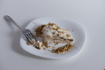 Composition a piece of cake with nut sprinkles