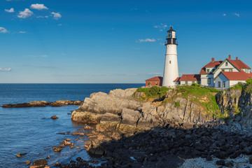 Fototapeta na wymiar Portland Head Lighthouse at sunset in Cape Elizabeth, New England, Maine, USA. 