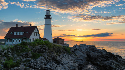 Fototapeta na wymiar Sunrise at Portland Head Lighthouse in Cape Elizabeth, New England, Maine, USA. 