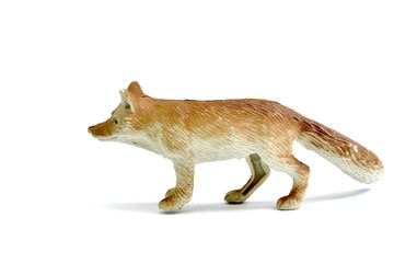 plastic wolf figurine toy on white background