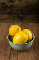 Lemon bowl on a wooden table